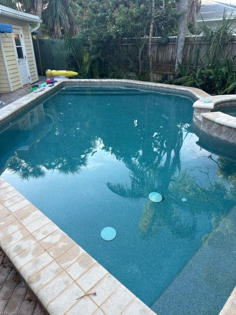 Pool technician performing weekly maintenance service